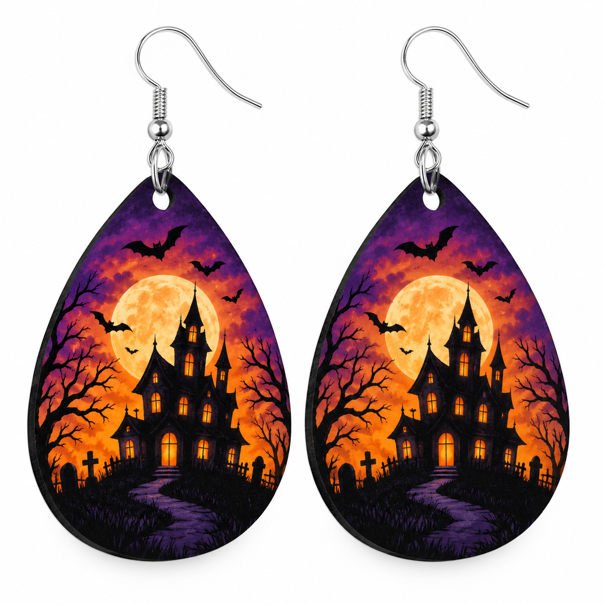 Halloween teardrop earrings with flying bats, an orange moon, and a purple sky